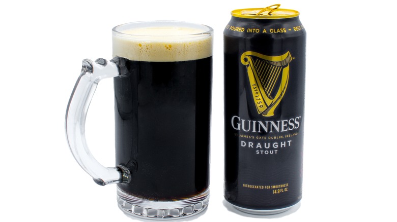 Can of Guinness in glass mug