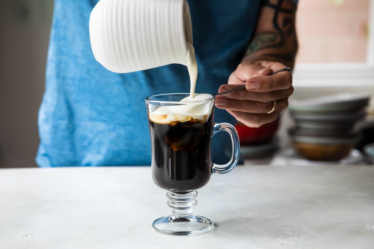 Pouring foam on Irish Coffee.